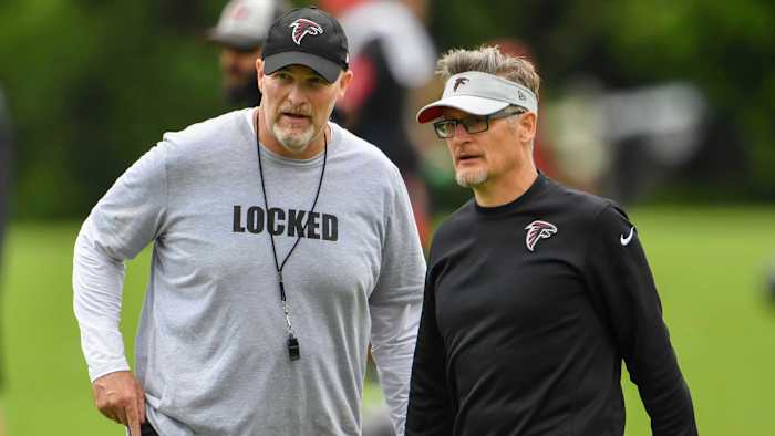 Falcons coach Dan Quinn talks with GM Thomas Dimitroff